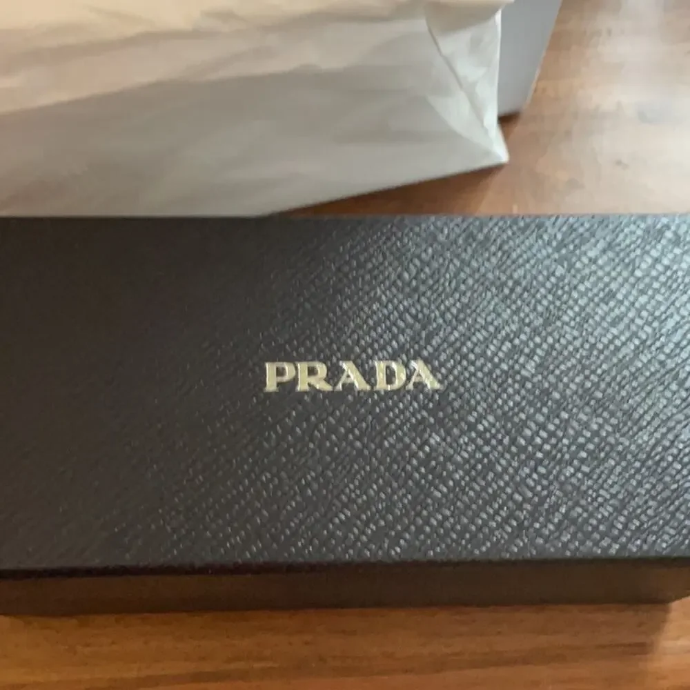 Prada 61mm Oval Sunglasses silver